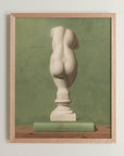 Fine art print framed hanging on a wall. The print shown is of a painting of the statue of Veunus. with a green background.