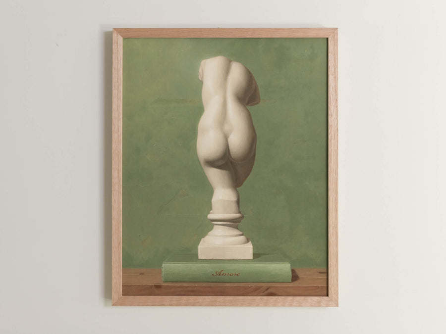 Fine art print framed hanging on a wall. The print shown is of a painting of the statue of Veunus. with a green background.